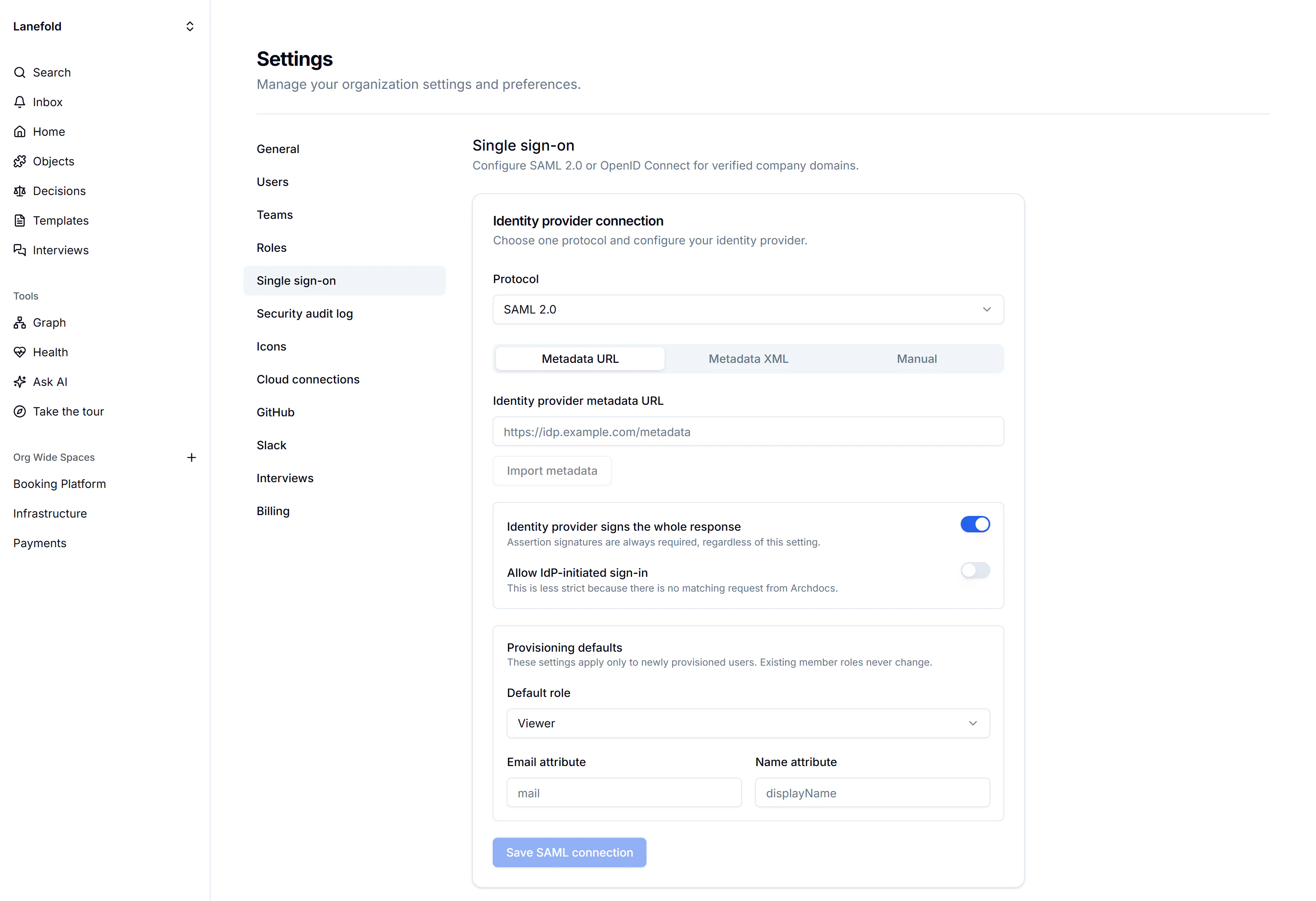 Unconfigured SAML identity provider form with metadata fields, response signing and provisioning switches, default role and attribute settings, and a disabled Save SAML connection button.